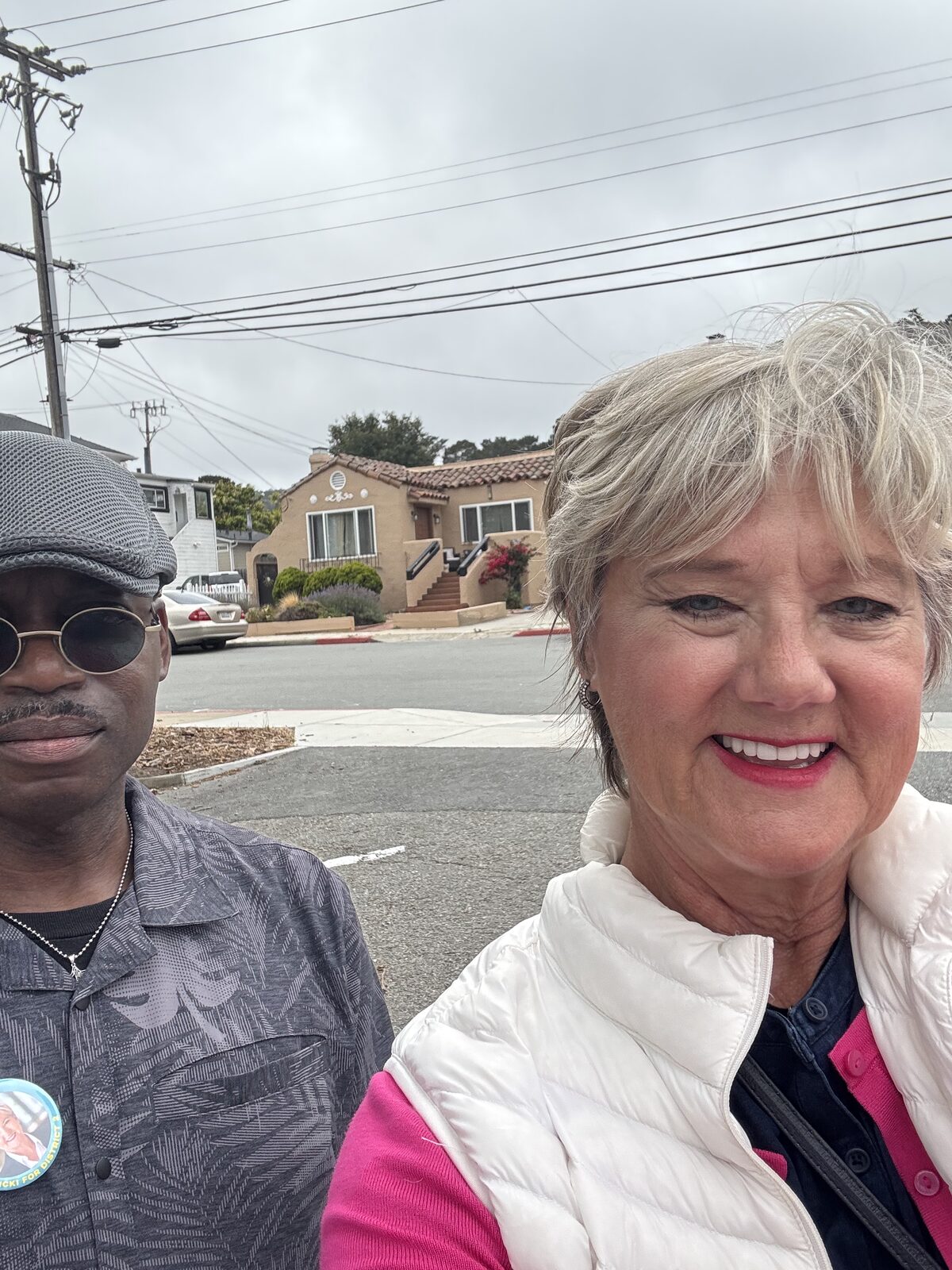 Meeting a neighbor sporting a Vicki for District 2 button.